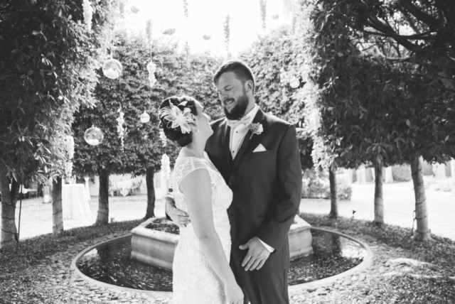Bride and groom’s sunset portrait in Hotel Escalante gardens, Naples FL