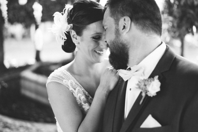Bride and groom’s sunset kiss at Hotel Escalante, Naples wedding
