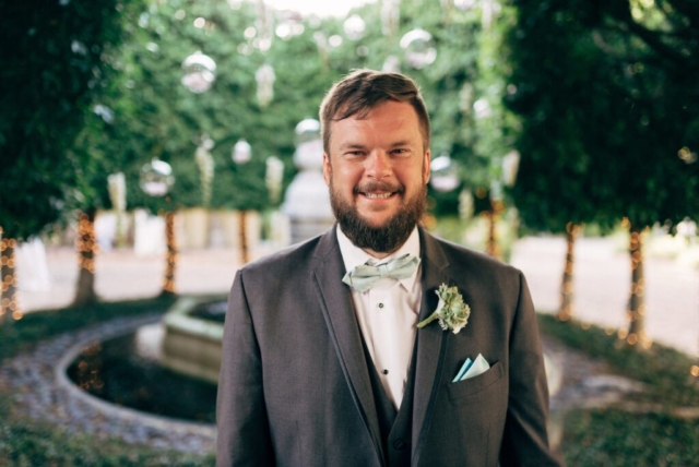 Naples wedding photographer, bride and groom under palm trees at Hotel Escalante