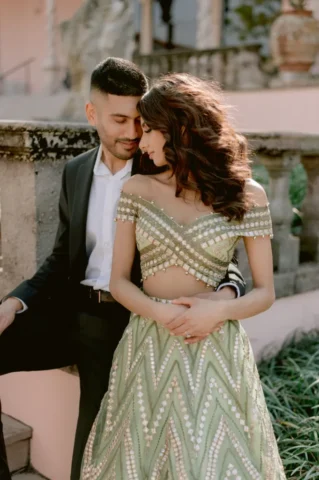 Rosh and Sab share an intimate moment during their Ringling Museum of Art engagement session, embodying the beauty of Desi love and tradition