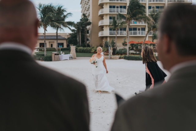 JW Marriott Marco wedding photographer, bride and groom on the boardwalk