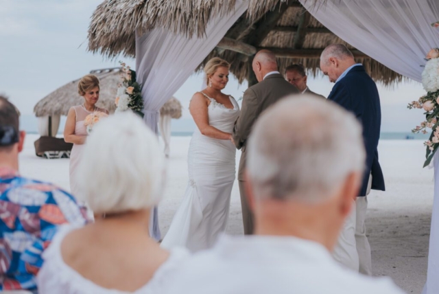 Bride and groom under palm trees, JW Marriott Marco wedding photographer