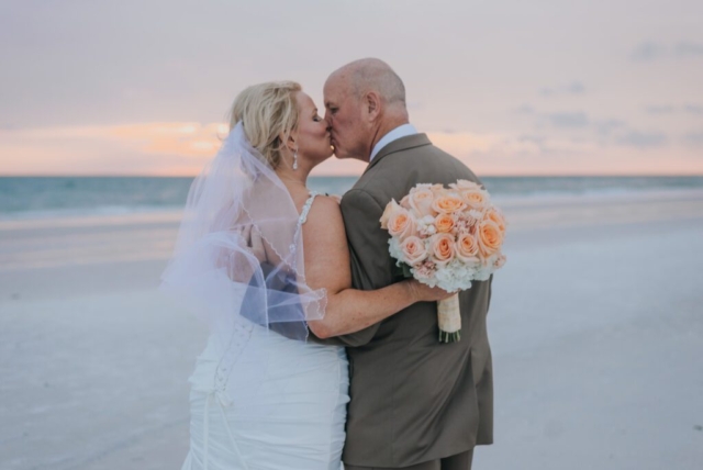 Bride and groom holding hands on Marco Island beach, JW Marriott wedding